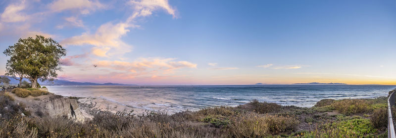 Scenic view of sea against cloudy sky