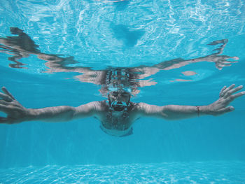 High angle view of man swimming in pool