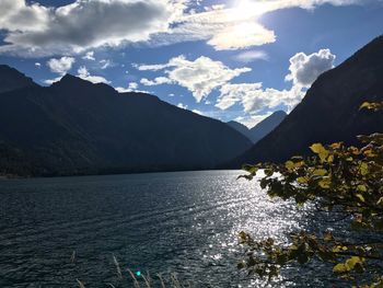 Scenic view of lake and mountains against sky