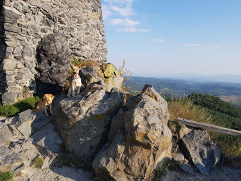 Rock formation on mountain against sky
