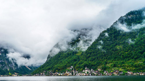 Scenic view of mountain village against sky