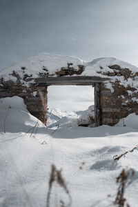 Snow covered land and mountains during winter