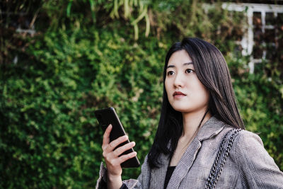 Young woman using mobile phone