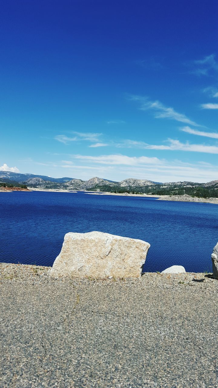 blue, water, sea, tranquil scene, tranquility, sky, beach, scenics, beauty in nature, nature, shore, sand, day, lake, copy space, idyllic, outdoors, calm, no people, coastline