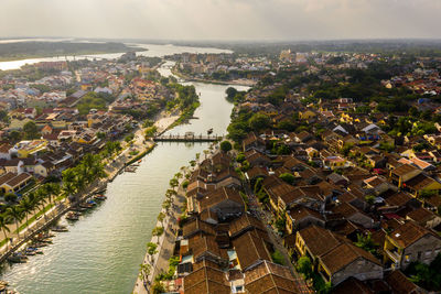 High angle view of river amidst buildings in town