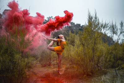 Full length of man standing on red land against sky