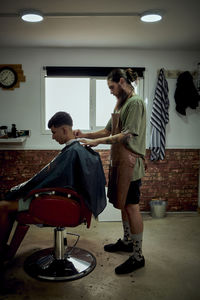 A hairdresser working in his own salon