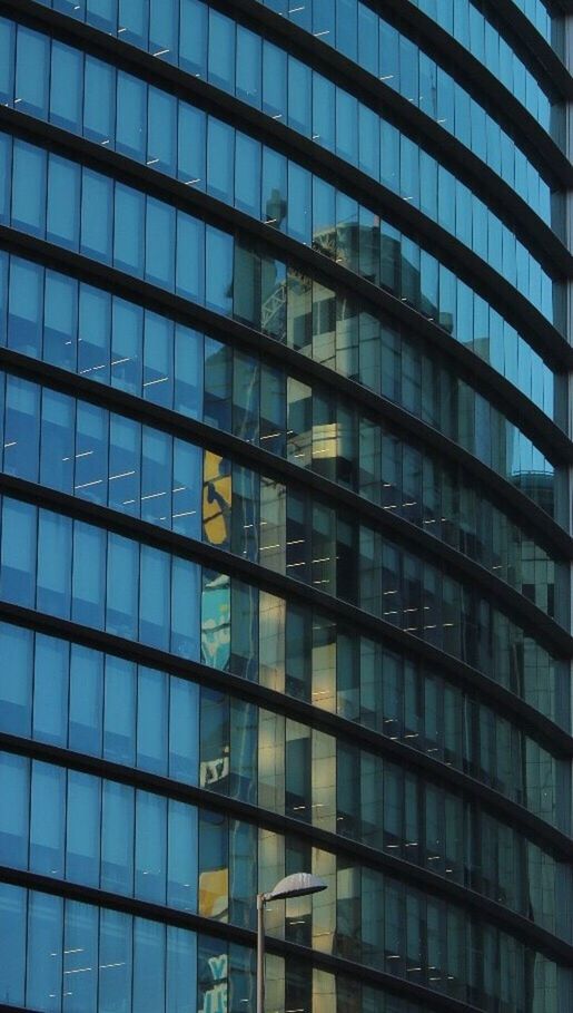 LOW ANGLE VIEW OF MODERN OFFICE BUILDING