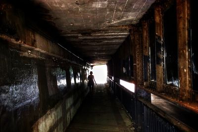 People walking in tunnel