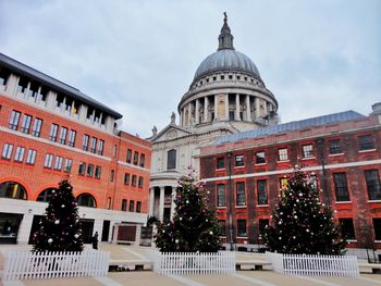 View of buildings in city against sky