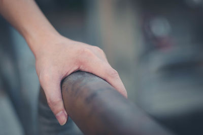 Close-up of person holding hands