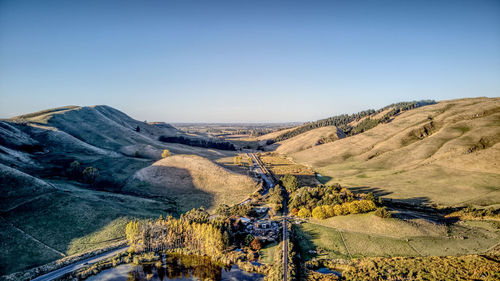 High angle view of road amidst landscape against clear sky