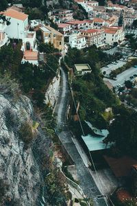 High angle view of buildings and trees in city