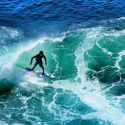 People surfing in sea