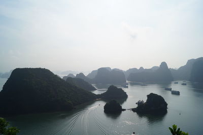 Panoramic view of sea and mountains against sky