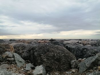 Rocks on land against sky