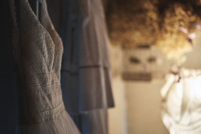 Close-up of clothes hanging in store