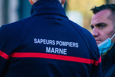 Rear view of man with text