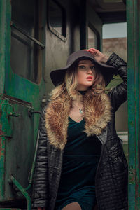 Portrait of young woman wearing hat
