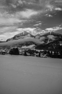 Scenic view of landscape against sky during winter