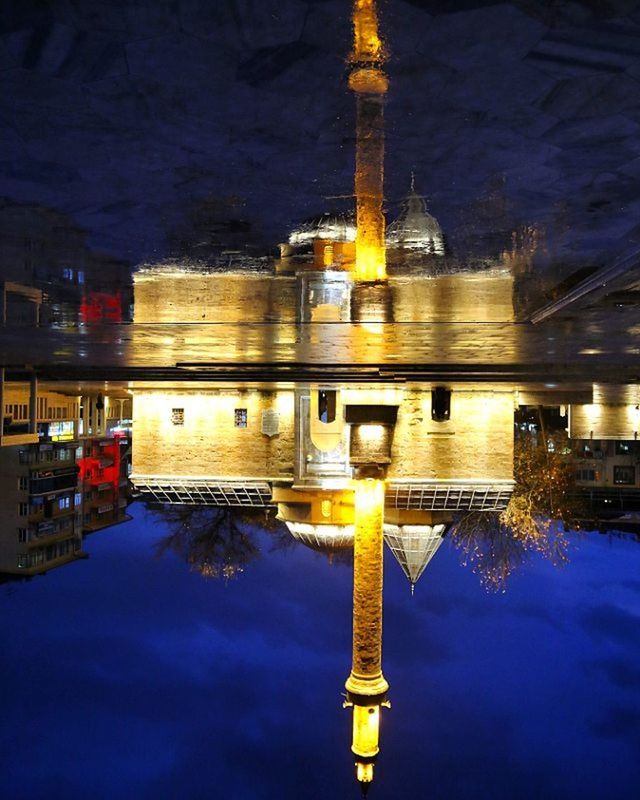 illuminated, reflection, water, architecture, built structure, travel destinations, night, famous place, tourism, waterfront, travel, building exterior, international landmark, lighting equipment, dusk, sky, religion, capital cities, architectural column, spirituality