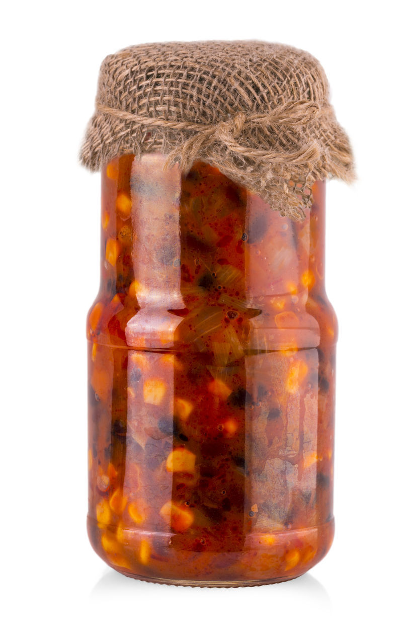 CLOSE-UP OF JAR AGAINST WHITE BACKGROUND