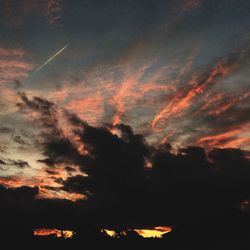 Low angle view of dramatic sky during sunset