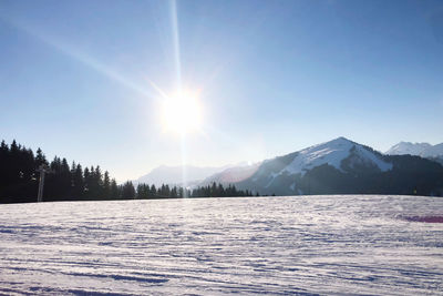 Scenic view of snowcapped mountains against sky