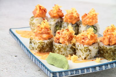 Close-up of serving food in plate on table