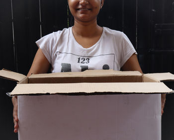 Low angle view of girl standing at home