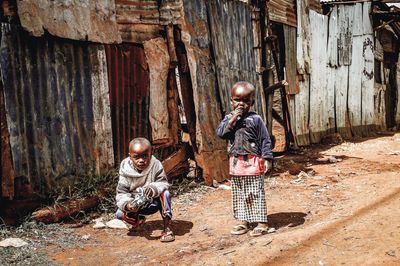 Portrait of children standing outdoors