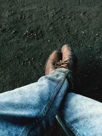 Low section of man sitting on floor