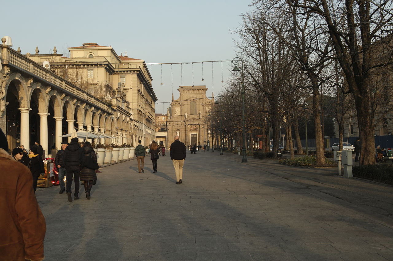 GROUP OF PEOPLE IN CITY STREET