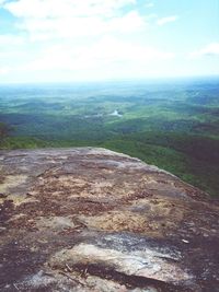 Scenic view of landscape against cloudy sky