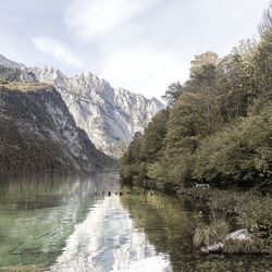 Scenic view of lake and mountains against sky