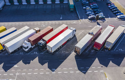 Trucks unloading in logostics center. aerial view