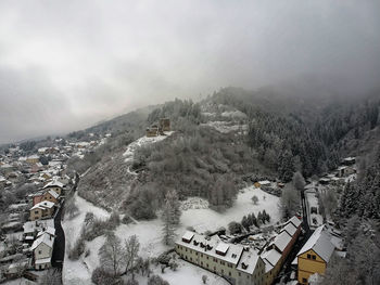 High angle view of buildings against sky during winter