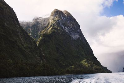 Scenic view of mountains and sea against sky