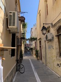 Narrow alley amidst buildings in city