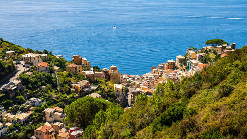 High angle view of townscape by sea