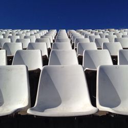 Rows of empty white chairs