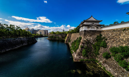 View of walls of the osaka castle close to the river