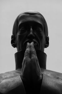 Low angle view of statue against sky