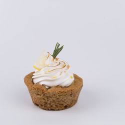 Close-up of cake against white background