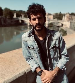 Portrait of young man standing outdoors