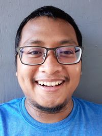 Portrait of smiling man wearing eyeglasses