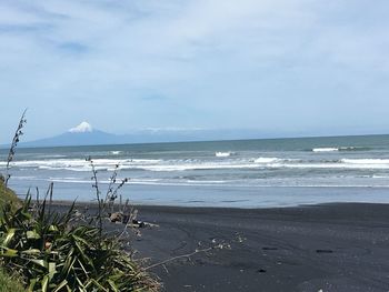 Scenic view of beach against sky