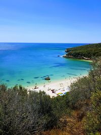 Scenic view of sea against clear blue sky