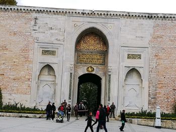 People in front of building