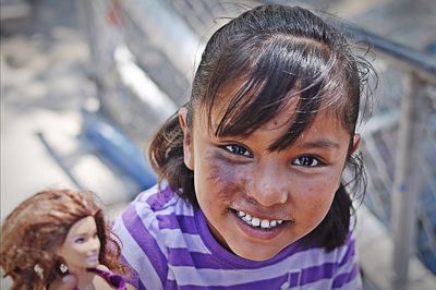 Close-up portrait of smiling girl